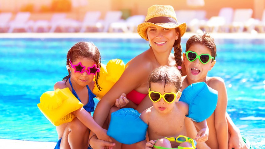 Happy family at the pool